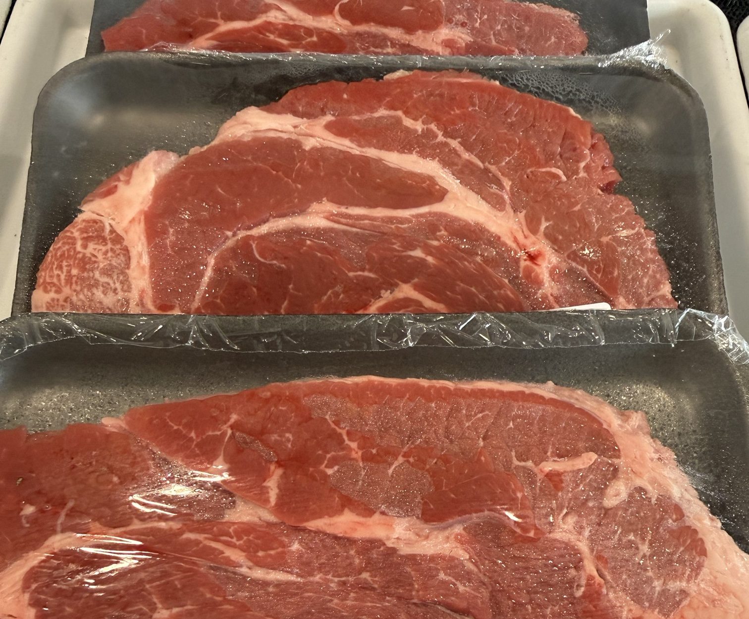 Fresh-cut boneless chuck steaks at The Old Town Butcher meat market in DeLand, FL