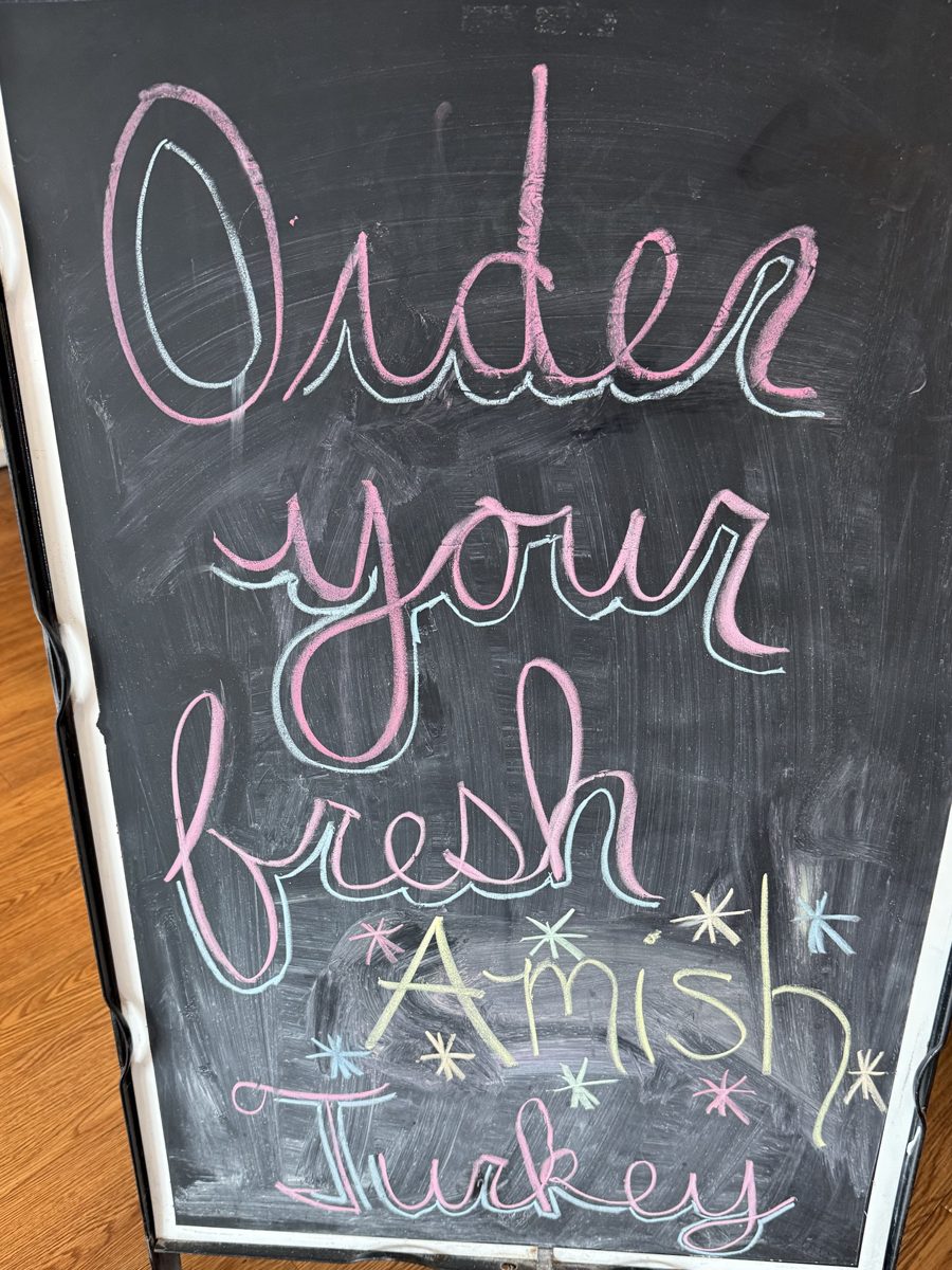 Chalkboard sign in the shop: Order your fresh Amish turkey